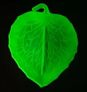 Uranium glass glowing under UV light