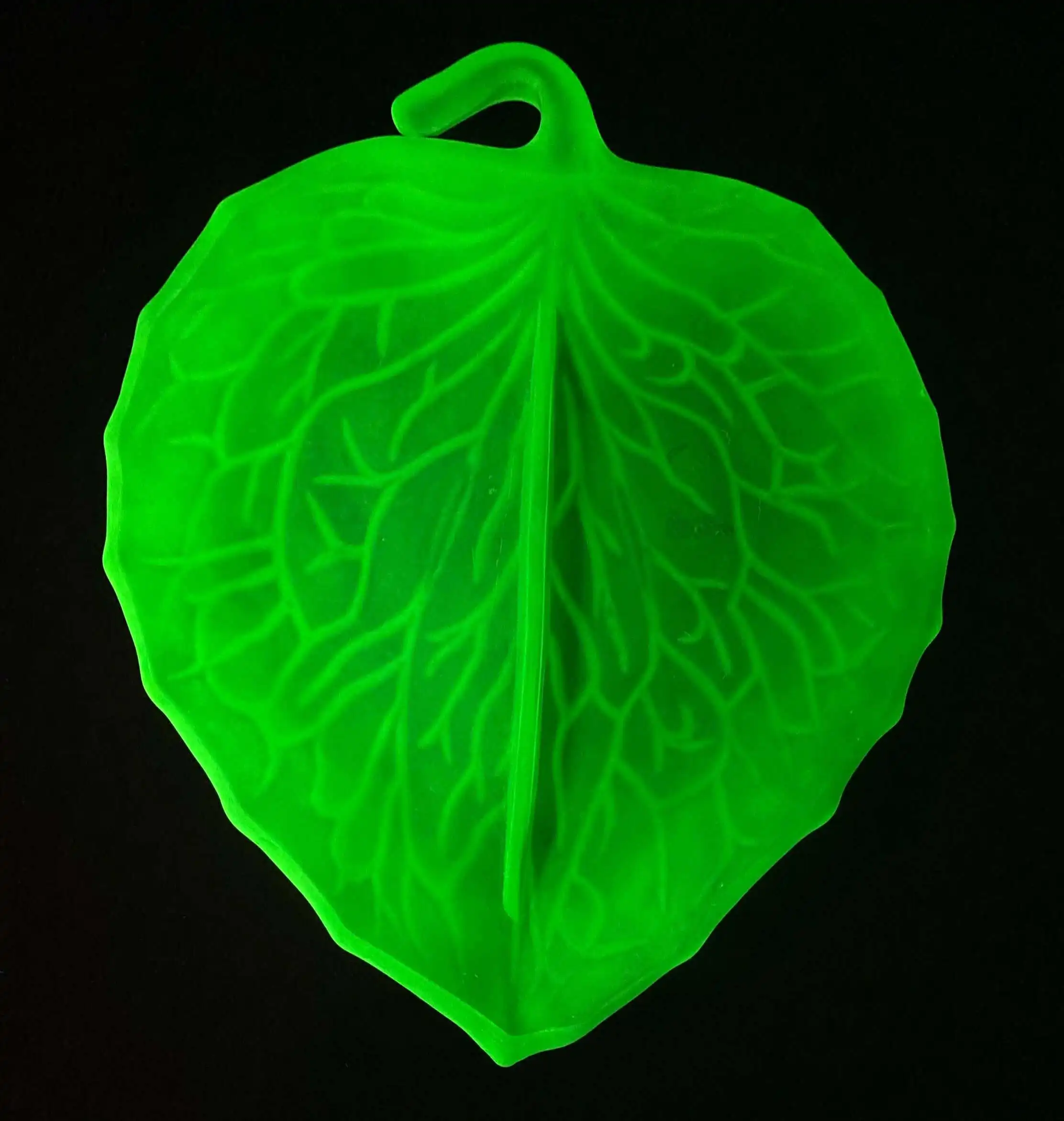 Uranium glass glowing under UV light